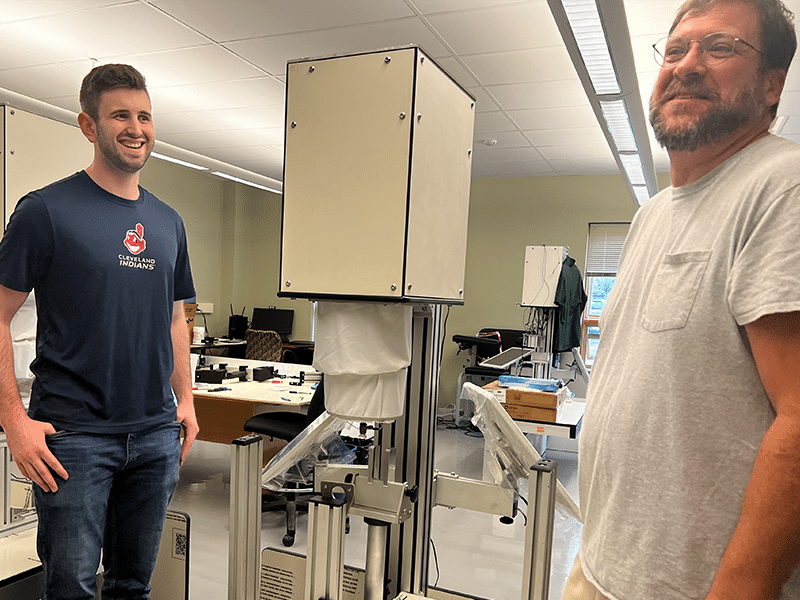 2023.06.22-odx-max-stoeckle-2 image of Max Stoeckle and Andrew Dick working in OsteoDx lab